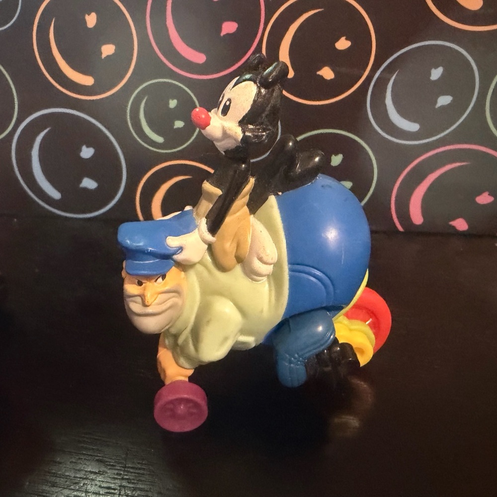 1993 Yakko riding a security guard named Ralph
